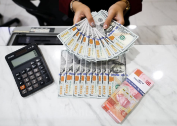 BI Tahan Suku Bunga, Rupiah Ditutup Melemah ke Level Rp15.499 per Dolar AS